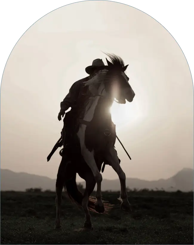 joaquin murietta riding a horse in from of a sunset