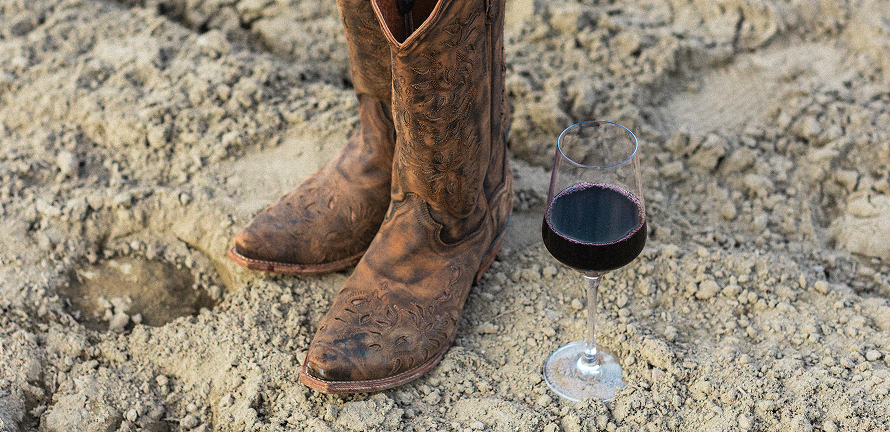 boots and wine on the ground